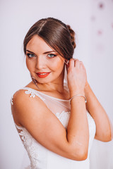 Naklejka premium Portrait of Beautiful Bride with Fashion MakeUp. Close Up. Bride in a wedding-dress is in fashion style.