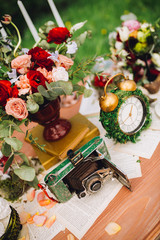 Obraz na płótnie Canvas luxury wedding decorations with bench, candle,flowers, decorated clock,