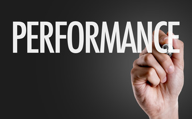 Hand writing the text: Performance