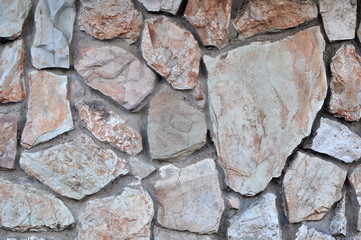 Wall of Rough Stones and Concrete Mortar Texture