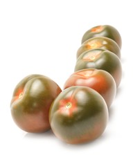 Tomato kumato isolated on white background