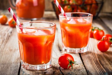 tomato juice with ice in glasses