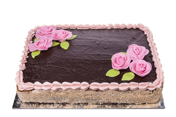 Celebratory chocolate cake with flowers of roses.