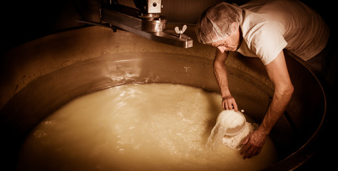 Cheesemaker -Traditional cheese making at a creamery,