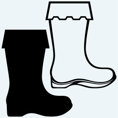 Old dirty boots. Isolated on blue background. Vector silhouettes
