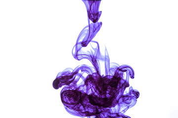 colored ink are swirling underwater