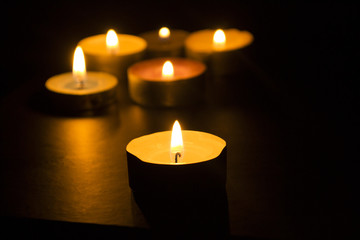 Burning candles in the dark
