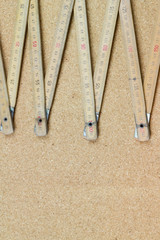 The old wooden meter on wood cork table / background texture