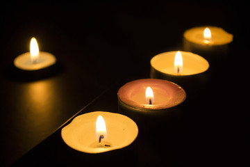 Burning candles in the dark
