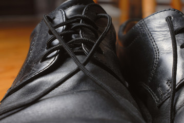 Black shoes lacing. Macro.