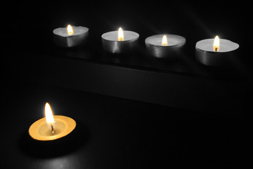 Burning candles in the dark
