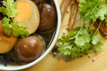 Stewed eggs  and pork brown sauce in white bowl