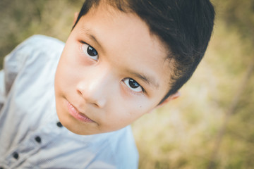 scared and alone, young Asian child 