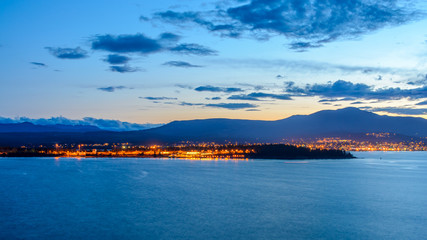 Tranquil sunset and evening illuminations of the beautiful town of Nanaimo on Pacific Ocean in Vancouver, Canada. © karamysh