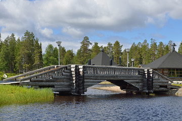 Fototapeta premium Log bridge over river north. Finland, Lapland