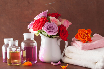 Obraz na płótnie Canvas essential oil and rose flowers aromatherapy spa perfumery
