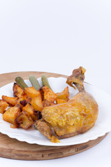 Roasted thighs and drumsticks with potatoes