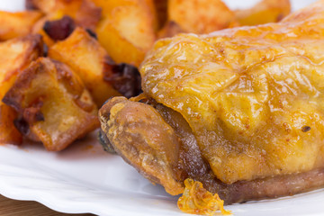 Roasted thighs and drumsticks with potatoes