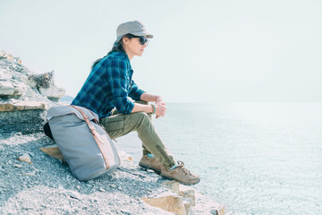 Traveler girl resting on coast