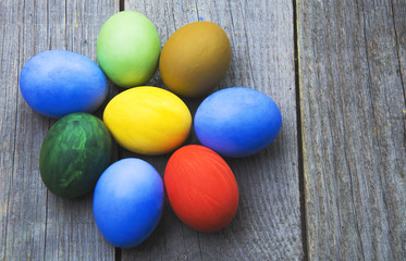 Easter eggs in nest on rustic wooden background, selective focus image, Card Happy Easter - space for text