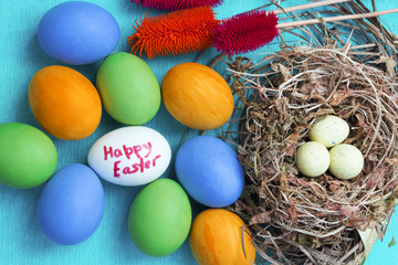 Easter eggs in nest on rustic wooden background, selective focus image, Card Happy Easter - space for text