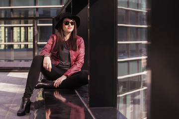 Fototapeta premium Young beautiful woman enjoying in the city
