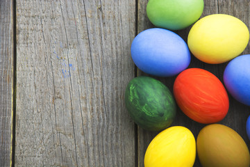 Easter eggs in nest on rustic wooden background, selective focus image, Card Happy Easter - space for text