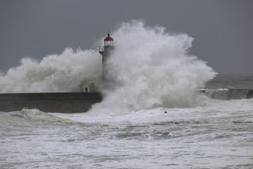Storm with big waves near a lighthouse - 106243866