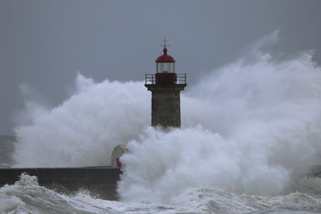 Storm with big waves near a lighthouse - 106243873