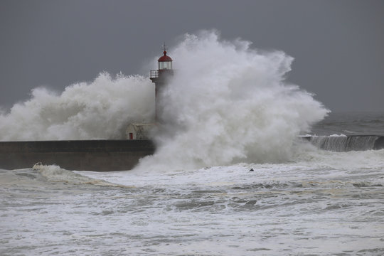 Storm with big waves near a lighthouse
