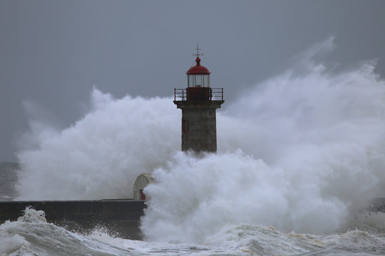Storm with big waves near a lighthouse