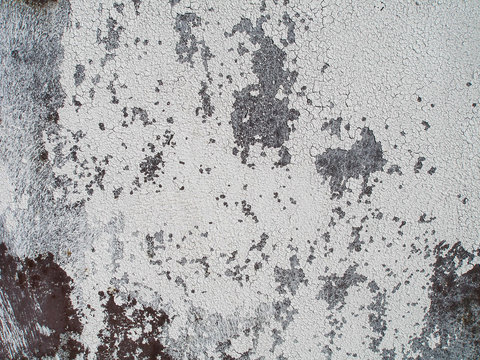 Cracked plaster on the wall. Grunge texture