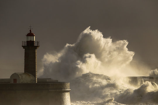 Storm with big waves near a lighthouse