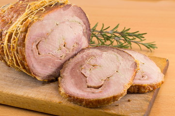 Rolled pork on a cutting board