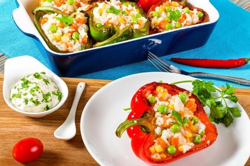 bell pepper stuffed with rice, green peas, carrots, top view