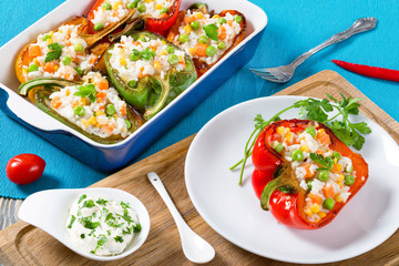 bell pepper stuffed with rice, green peas, carrots, top view