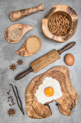 Baking utensils and ingredients on kitchen table