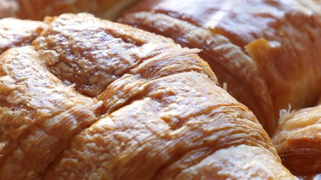 Famous in France croissant tasty dough roll arranged 4K 2160p 30fps UltraHD footage - Viennoiserie buttery Vienna-style pastry 4K 3840X2160 UHD video 