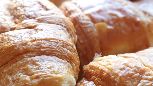 French croissant tasty dough roll arranged 4K 2160p 30fps UltraHD footage - Viennoiserie buttery Vienna-style pastry 4K 3840X2160 UHD video 