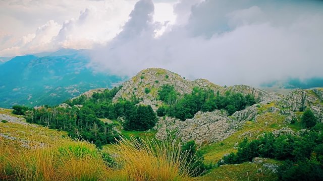 Cloudy weather view of the highest peaks of the Lovcen mountain national park in southwestern Montenegro.