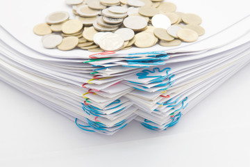 Step pile of paperwork with colorful paperclip have stack gold coins