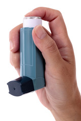 Asthma ventolin salbutamol inhaler held in hand isolated on white background photo
