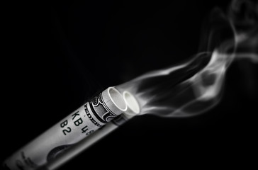 Smoking dollars gun