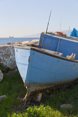 Fototapeta na wymiar Blue grungy boat close up
