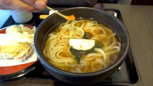 Soba Noodles Soup in Japanese Restaurant With Nanami Togarashi Chili Powder