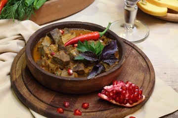 meat with hot pepper and braised in a pomegranate sauce