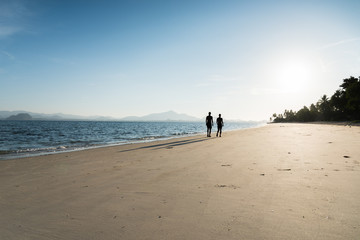 silhouette running on the island beach