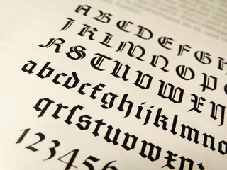 old typeface, gothic texture. Book page with calligraphy.