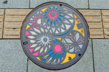 A colorful manhole cover in Matsumoto, Japan