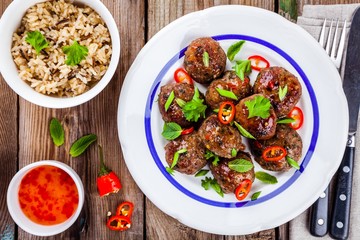 homemade meatballs with wild rice, mint, green onions and chili sauce